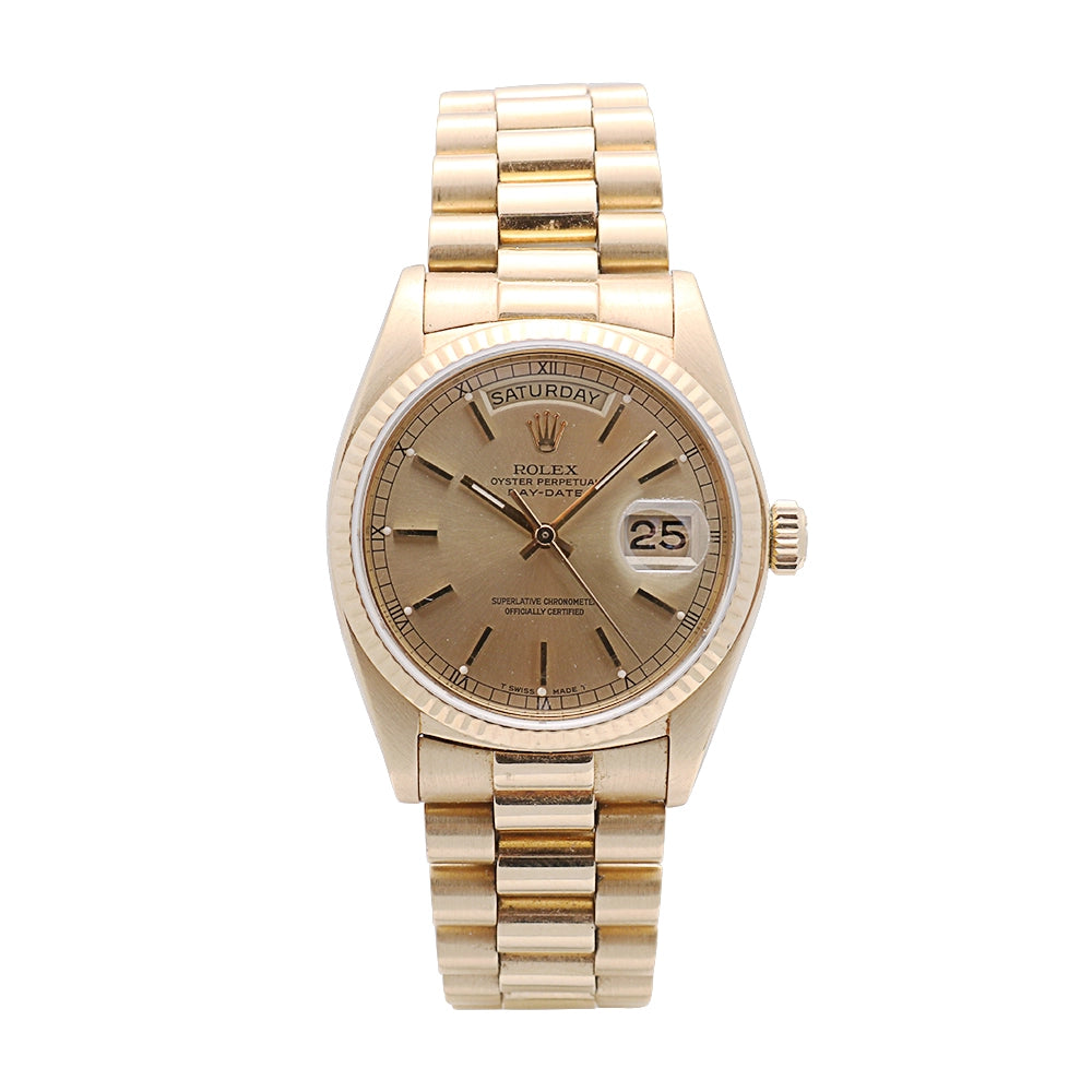 Rolex Day-Date. Fluted bezel. Champagne index dial. President bracelet (Preowned)